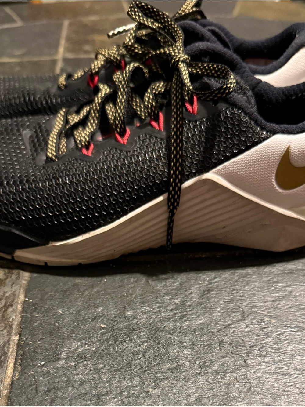 Nike Women’s Black and Gold Metcon 3 shoes